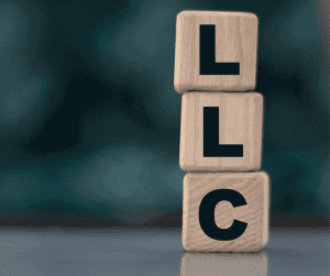 wooden blocks with "LLC" on them